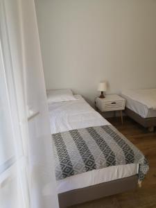 Łóżko lub łóżka w pokoju w obiekcie Apartament przy Starówce