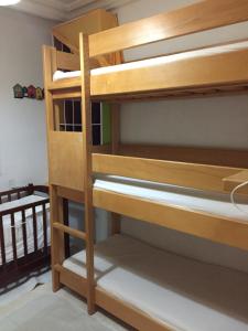 a stack of bunk beds in a room at Belaire host appartment in Boumhel El Bassatine