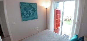 A bed or beds in a room at Apartamento Pardela