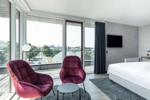 Radisson RED Aarhus客房内的一张或多张床位