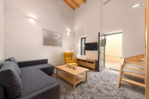 a living room with a couch and a table at Niochori apartments 1 in Rhodes Town