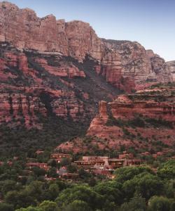 a village in front of a mountain at Enchantment Resort in Sedona