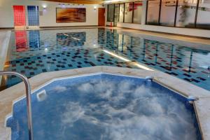 a swimming pool filled with lots of water at Best Western Chilworth Manor Hotel in Southampton