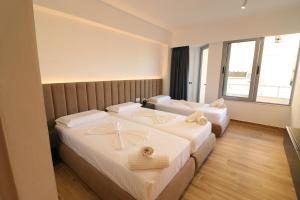 Postel nebo postele na pokoji v ubytování Hotel Tatzati 2 + 28 fotografií