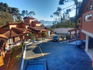 a view of a parking lot at a house at Pousada Cravo & Canela in Campos do Jordão