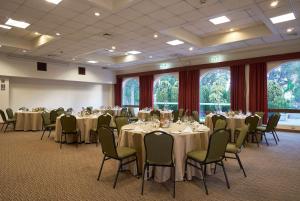 a banquet room with tables and chairs and windows at Wyndham Costa del Sol Arequipa in Arequipa +129 photos