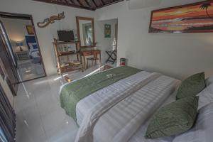 Ein Bett oder Betten in einem Zimmer der Unterkunft Tirta Bali Villa