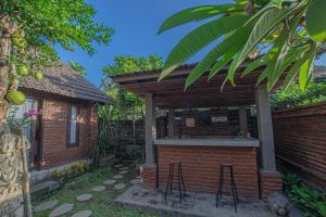 Ein Garten an der Unterkunft Tirta Bali Villa