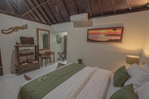 Ein Bett oder Betten in einem Zimmer der Unterkunft Tirta Bali Villa