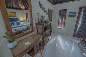 Ein Bett oder Betten in einem Zimmer der Unterkunft Tirta Bali Villa
