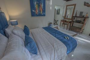 Ein Bett oder Betten in einem Zimmer der Unterkunft Tirta Bali Villa