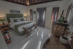 Ein Bett oder Betten in einem Zimmer der Unterkunft Tirta Bali Villa
