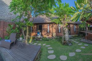 Ein Garten an der Unterkunft Tirta Bali Villa