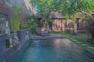 Бассейн в Tirta Bali Villa или поблизости