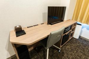 a desk with a television on top of it at Hotel Kazusaya in Tokyo