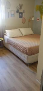 a bedroom with a bed in a room at Departamento Central in Arica +17 photos