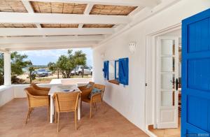 a dining room with a table and chairs at Casita Del Puerto Formentera Passport in La Savina