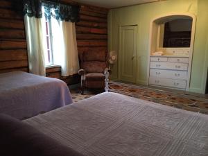 Postel nebo postele na pokoji v ubytování Gakona Lodge