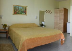 En eller flere senge i et værelse på Tamarind Tree Hotel