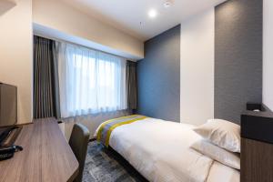 Postel nebo postele na pokoji v ubytování Hotel Kazusaya