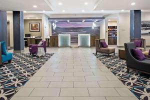 a lobby with chairs and a waiting room at La Quinta by Wyndham York in York
