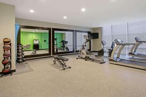 a gym with several treadmills and elliptical machines at La Quinta by Wyndham York in York