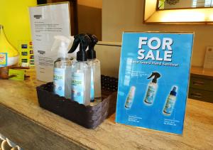 a for sale sign and two bottles of detergent on a counter at MaxOneHotels.com at Sabang in Jakarta
