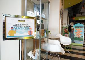 a sign in a glass case in a store at MaxOneHotels.com at Sabang in Jakarta