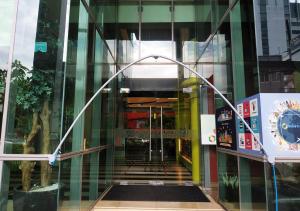 a glass facade of a building with a hallway at MaxOneHotels.com at Sabang in Jakarta