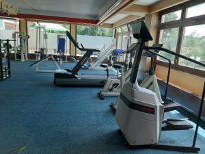 a gym with several treadmills and machines at Apartment Anja in Schluchsee