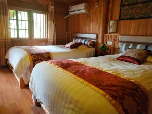 Postel nebo postele na pokoji v ubytování Bridge View Boutique Guesthouse 望桥楼精品民宿