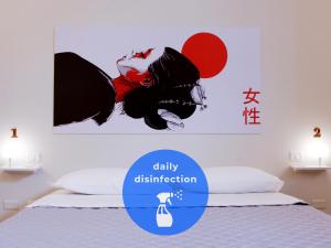 A bed or beds in a room at Lobby Collective Hostel - Lecce