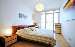 Ένα ή περισσότερα κρεβάτια σε δωμάτιο στο Apartament Wydmowy Osiedle Polanki +20 φωτογραφίες