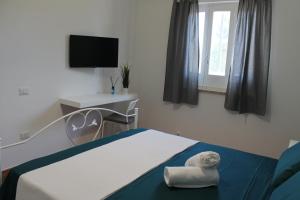 Postel nebo postele na pokoji v ubytování Il giardino di Artemide