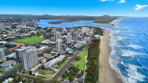 an aerial view of a city and the ocean at Elouera Tower in Maroochydore