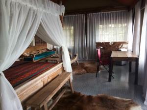 Postel nebo postele na pokoji v ubytování Sang Giri Mountain Tent Resort