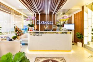 a lobby of a flower shop with a welcome counter at Venice 1 Hotel in Ho Chi Minh City