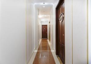 an empty hallway with a door and a hallwayngth at Venice 1 Hotel in Ho Chi Minh City