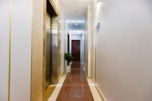 a hallway with a plant in a building at Venice 1 Hotel in Ho Chi Minh City