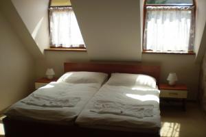 Voodi või voodid majutusasutuse Rybárska bašta Nitra toas