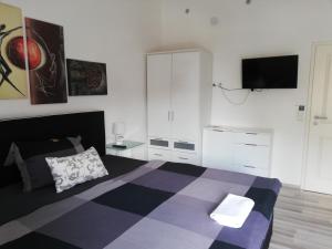 TV/Unterhaltungsangebot in der Unterkunft Villaci Business Apartments
