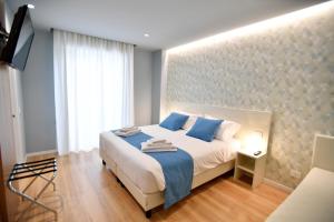 Postel nebo postele na pokoji v ubytování Nina B&B