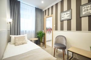 Posteľ alebo postele v izbe v ubytovaní Apartamenty Klasztorna 25