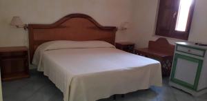 Postel nebo postele na pokoji v ubytování Albergo Athena Mare