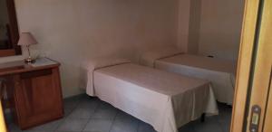 Postel nebo postele na pokoji v ubytování Albergo Athena Mare