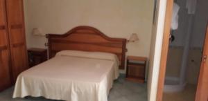 Postel nebo postele na pokoji v ubytování Albergo Athena Mare