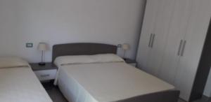 Postel nebo postele na pokoji v ubytování Albergo Athena Mare