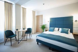 Posteľ alebo postele v izbe v ubytovaní Apartamenty Klasztorna 25