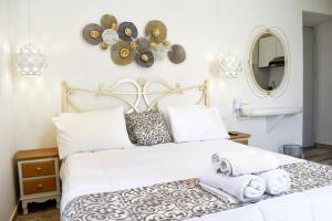 A bed or beds in a room at Naxos Enjoy Apartments