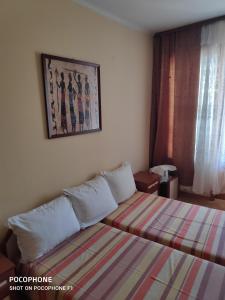 Postel nebo postele na pokoji v ubytování Homestay Kostadinov